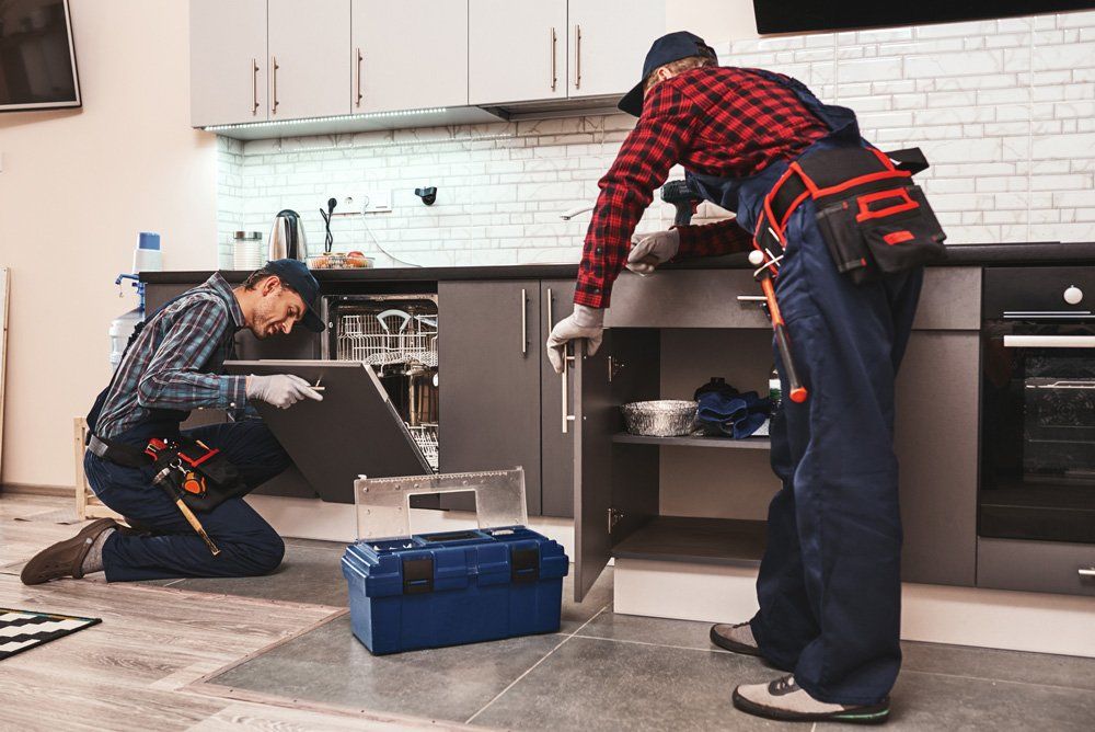 Plumbers Fixing Kitchen Sink — Oceano, CA — Nate’s Plumbing & HVAC