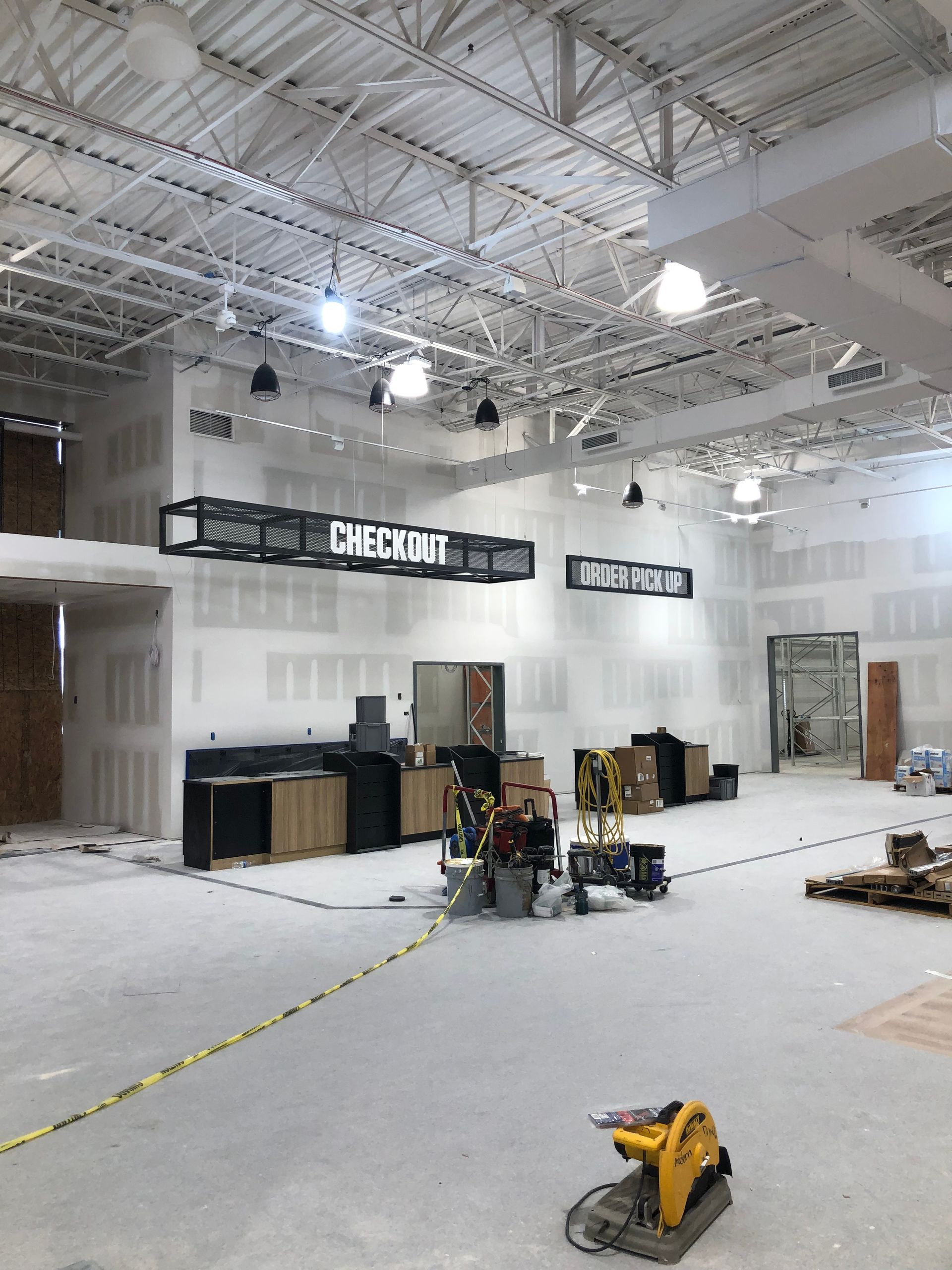 A large room with a sign that says check out on it