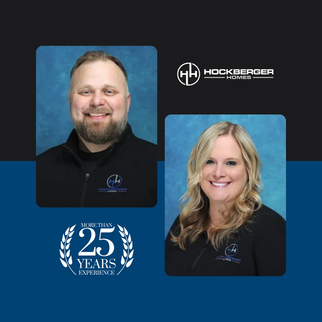 A man and a woman are standing next to each other with a 25 years logo in the background