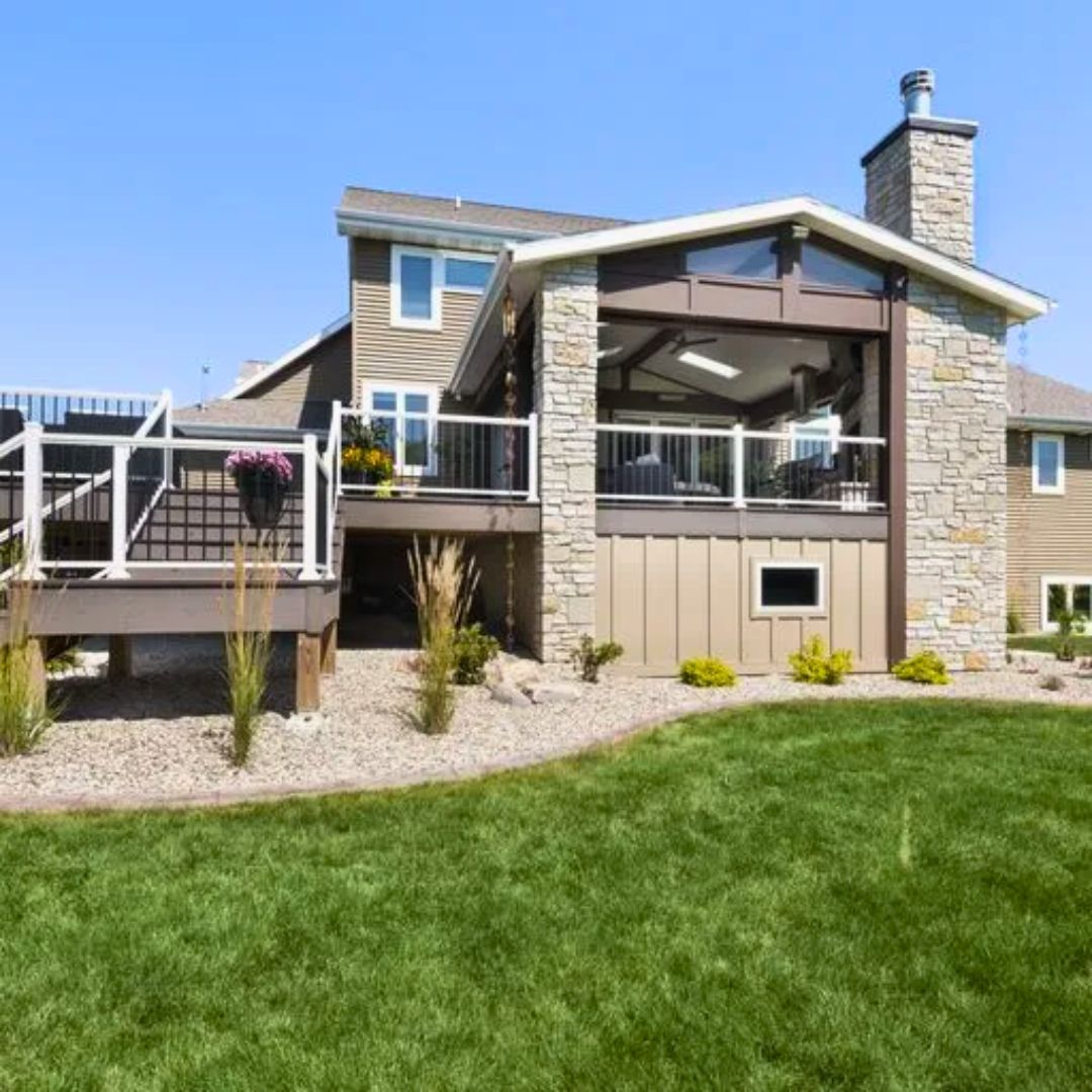 A large house with a large lawn in front of it