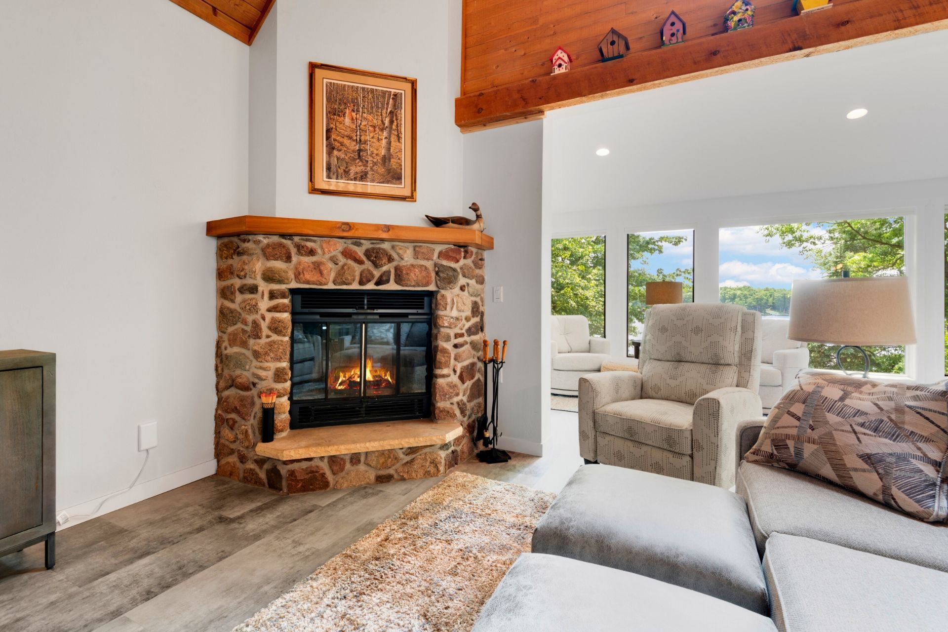 There is a fireplace in the middle of the living room.