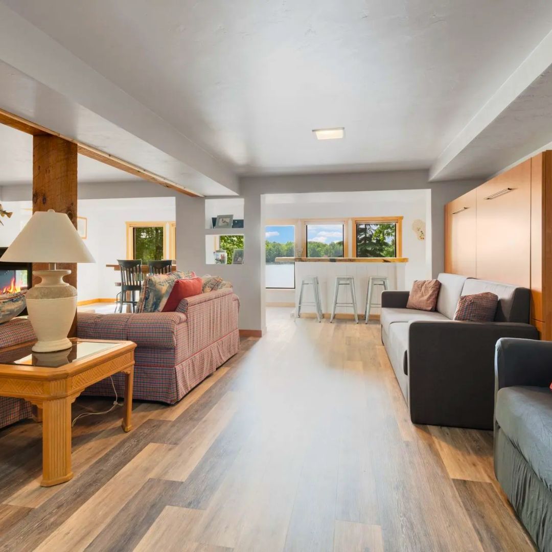 A living room filled with furniture and a lamp