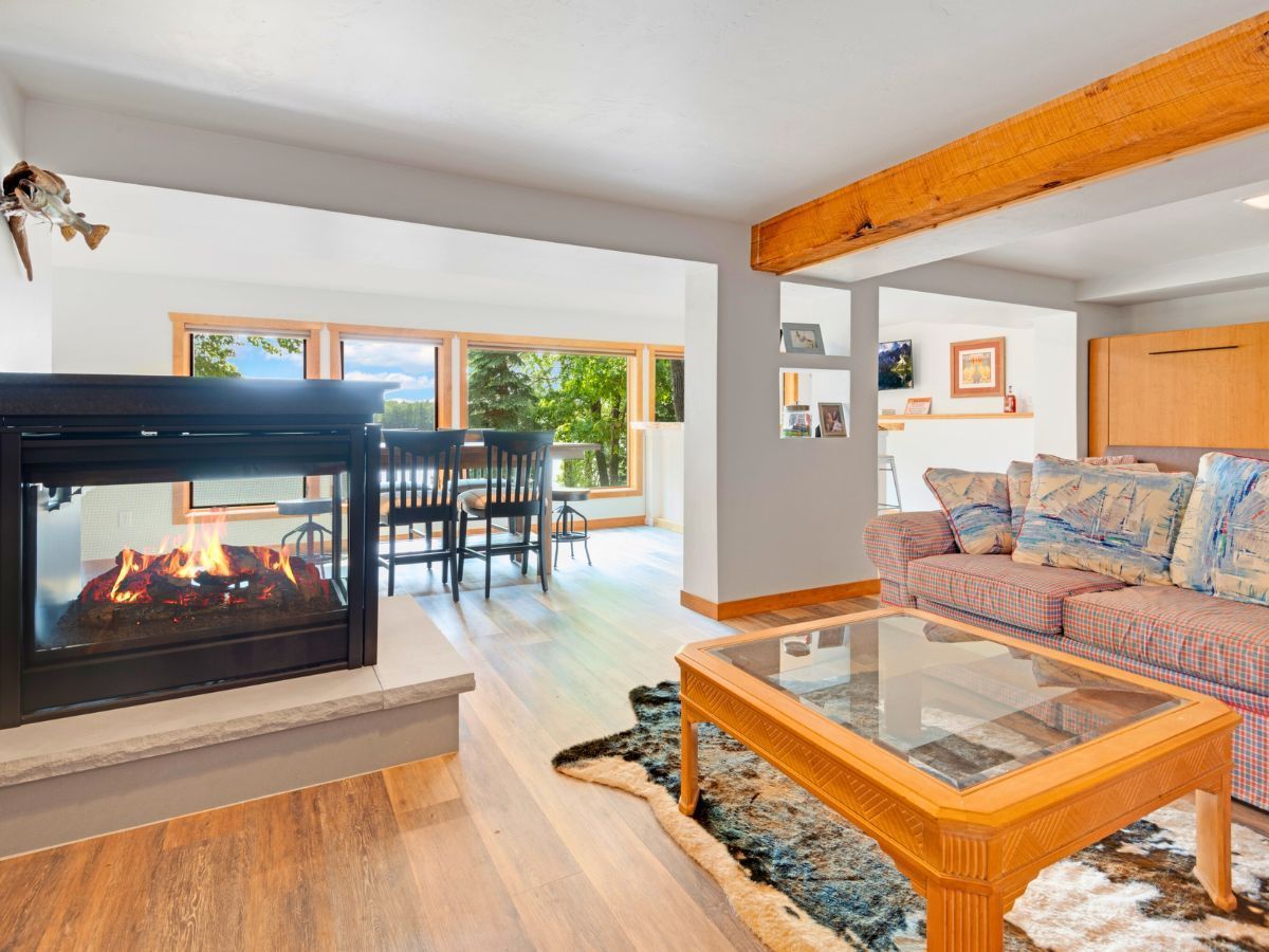 A living room with a fireplace and a couch.