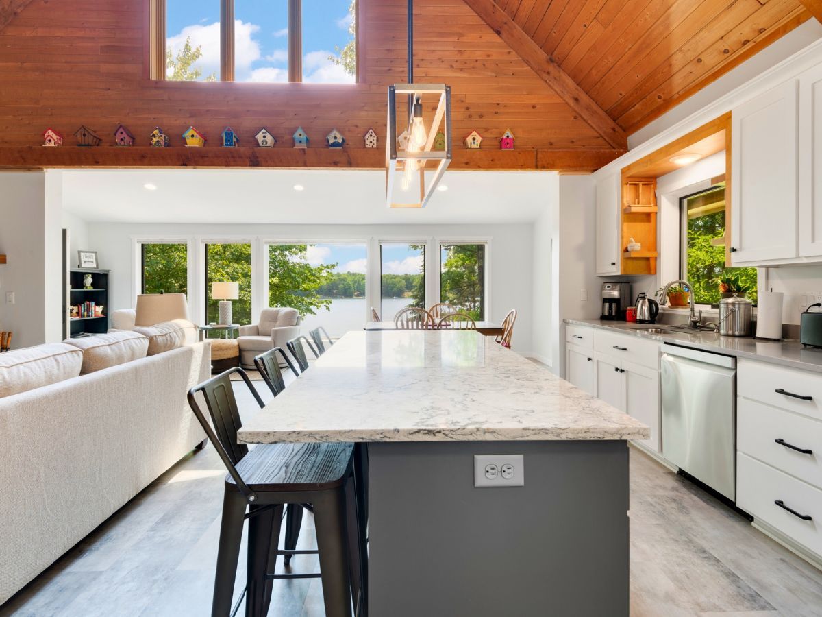 A kitchen with a large island in the middle of the room.
