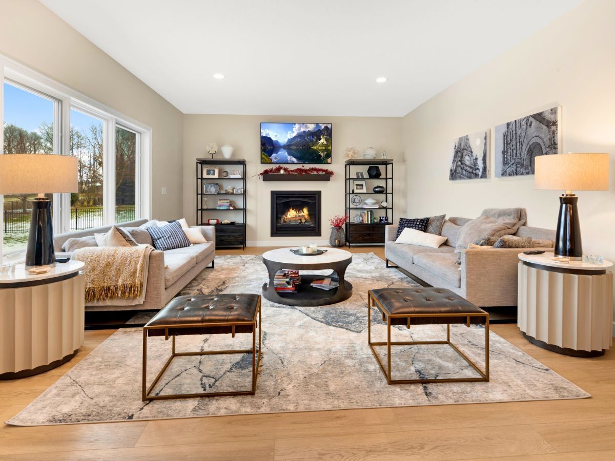 A living room filled with furniture and a fireplace.