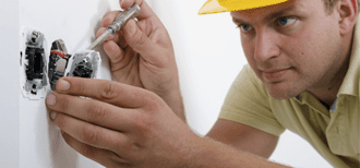 Man Repairing Electrical Socket
