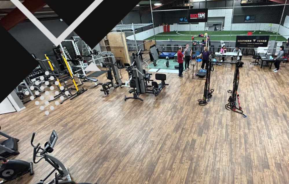 An aerial view of a gym filled with lots of exercise equipment.