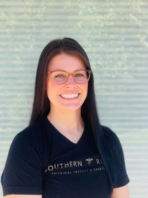 A woman wearing glasses and a black shirt that says southern
