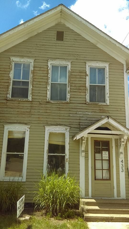 A house with a lot of windows is for sale