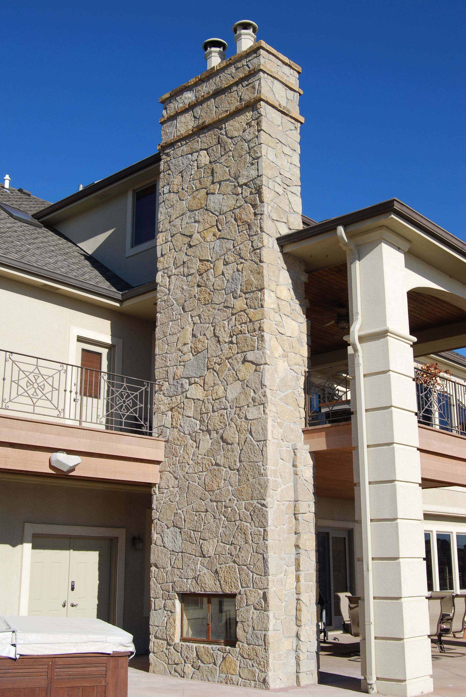 Remove all the brick off this chimney and replaced with new stone and added decorative trims up on the top of the stack , Home located in Westshore in Waterloo, Nebraska