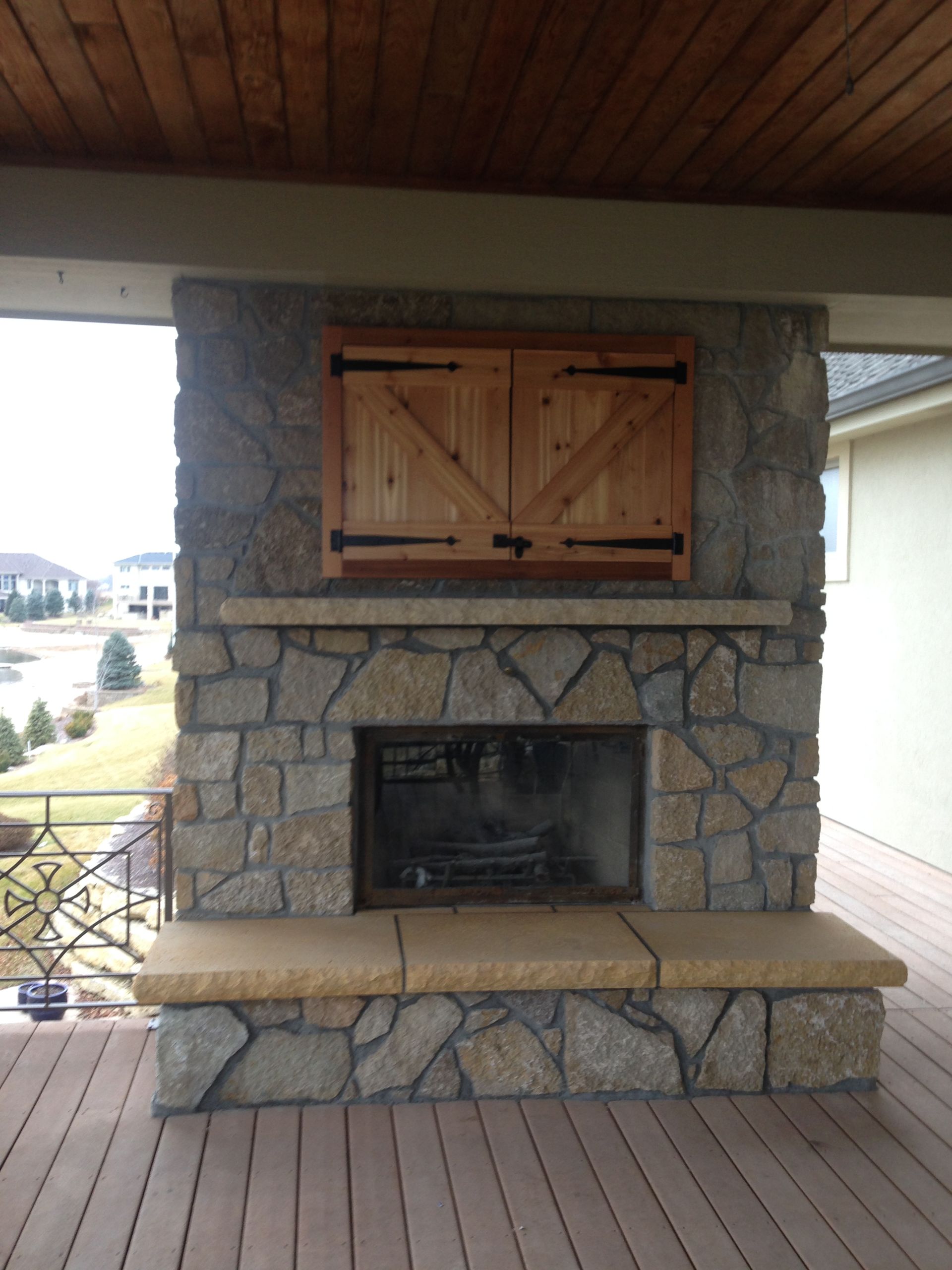 Fireplace that we overhauled in the Westshore neighborhood in Waterloo, Nebraska. We installed all new stone and stone hearth and also installed a custom made cabinet to hold an lcd tv .