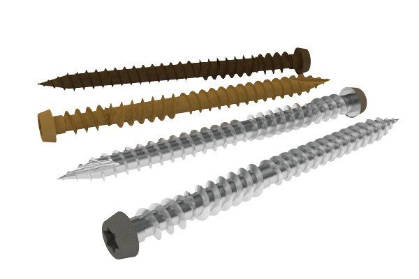 Four different types of screws are lined up on a white surface.