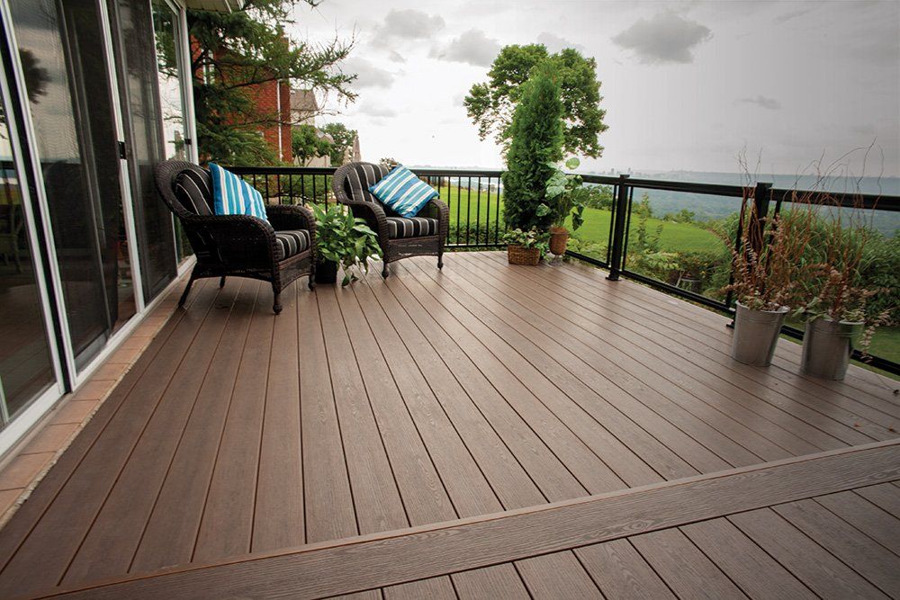 A wooden deck with a view of the ocean