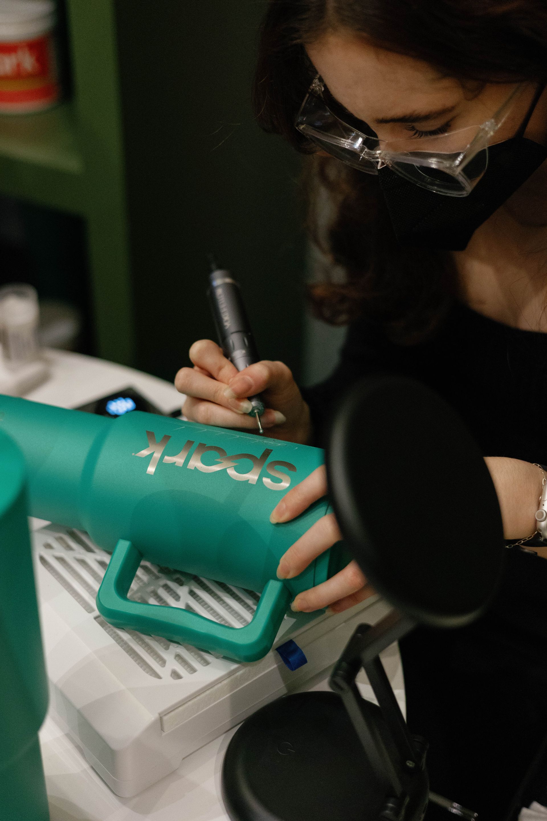 Woman wearing a mask and glasses engraving 