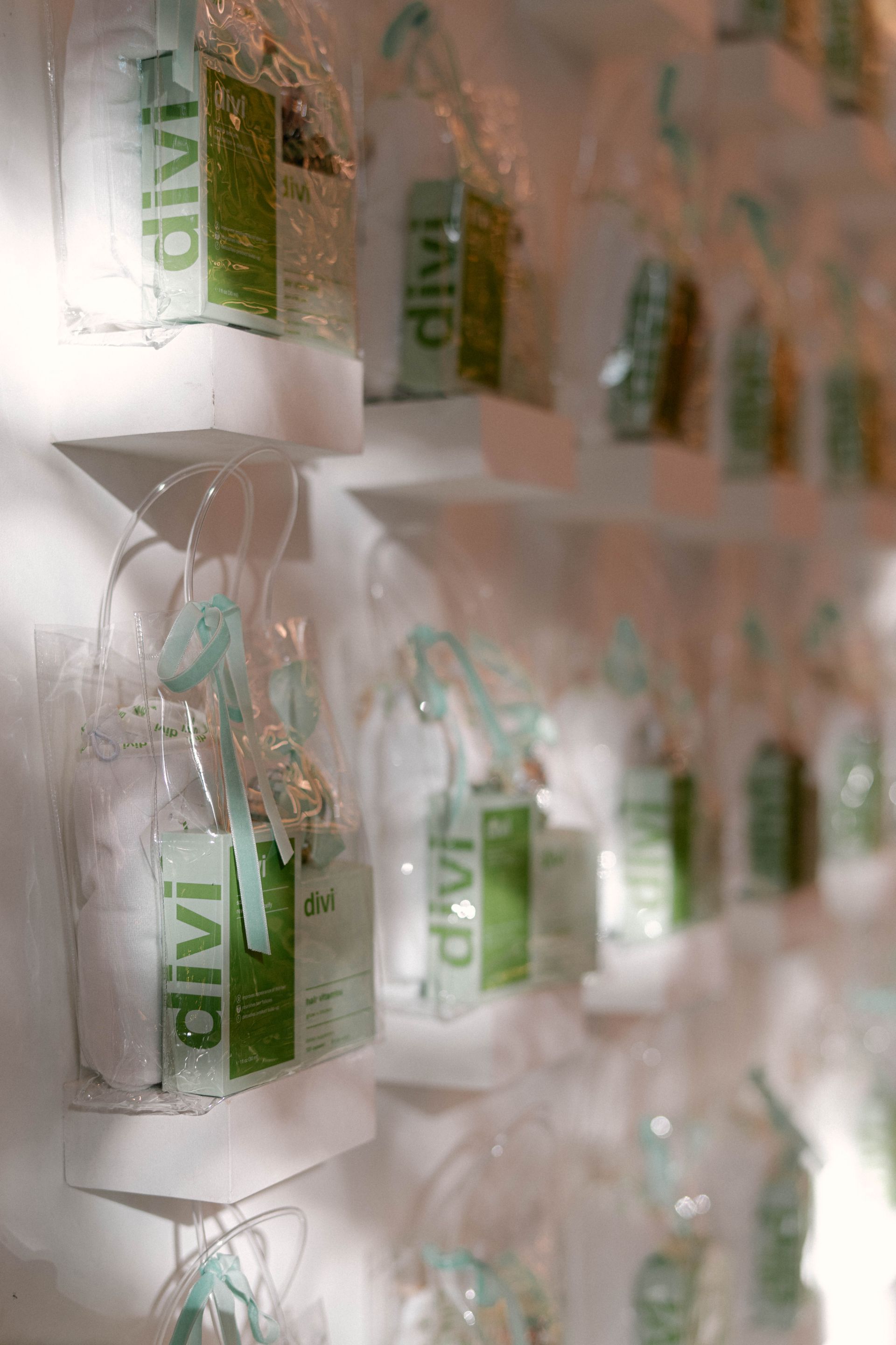 Bags of products wrapped in clear plastic on white shelves, featuring 