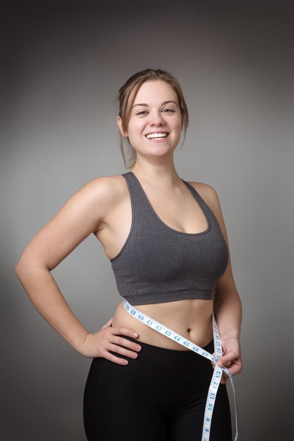 fitness model on gray background