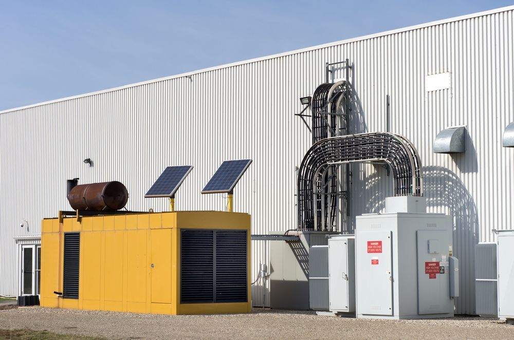 Yellow Industrial Generator Unit With Pipes — CQ Pro-Lec in Pacific Heights, QLD