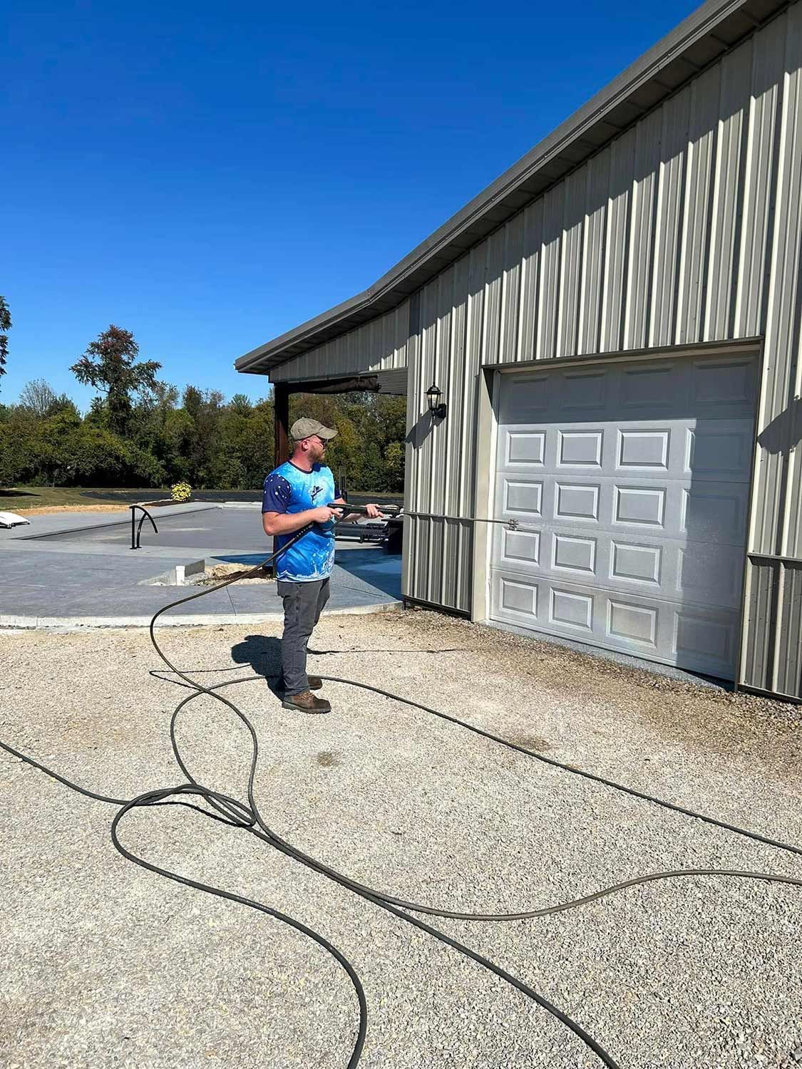 Worker Cleaning the Garage