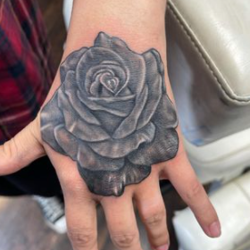 Flower In Hand Tattoo