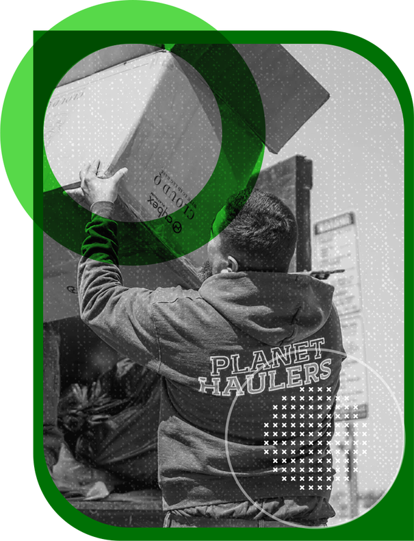 A black and white photo of a man holding a box that says planet haulers