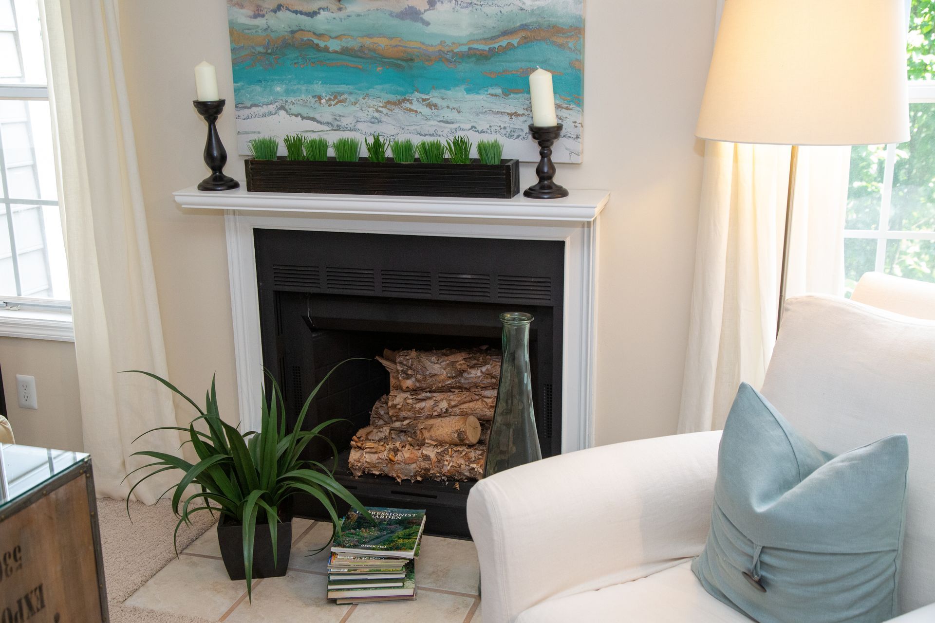 A living room with a fireplace and a chair