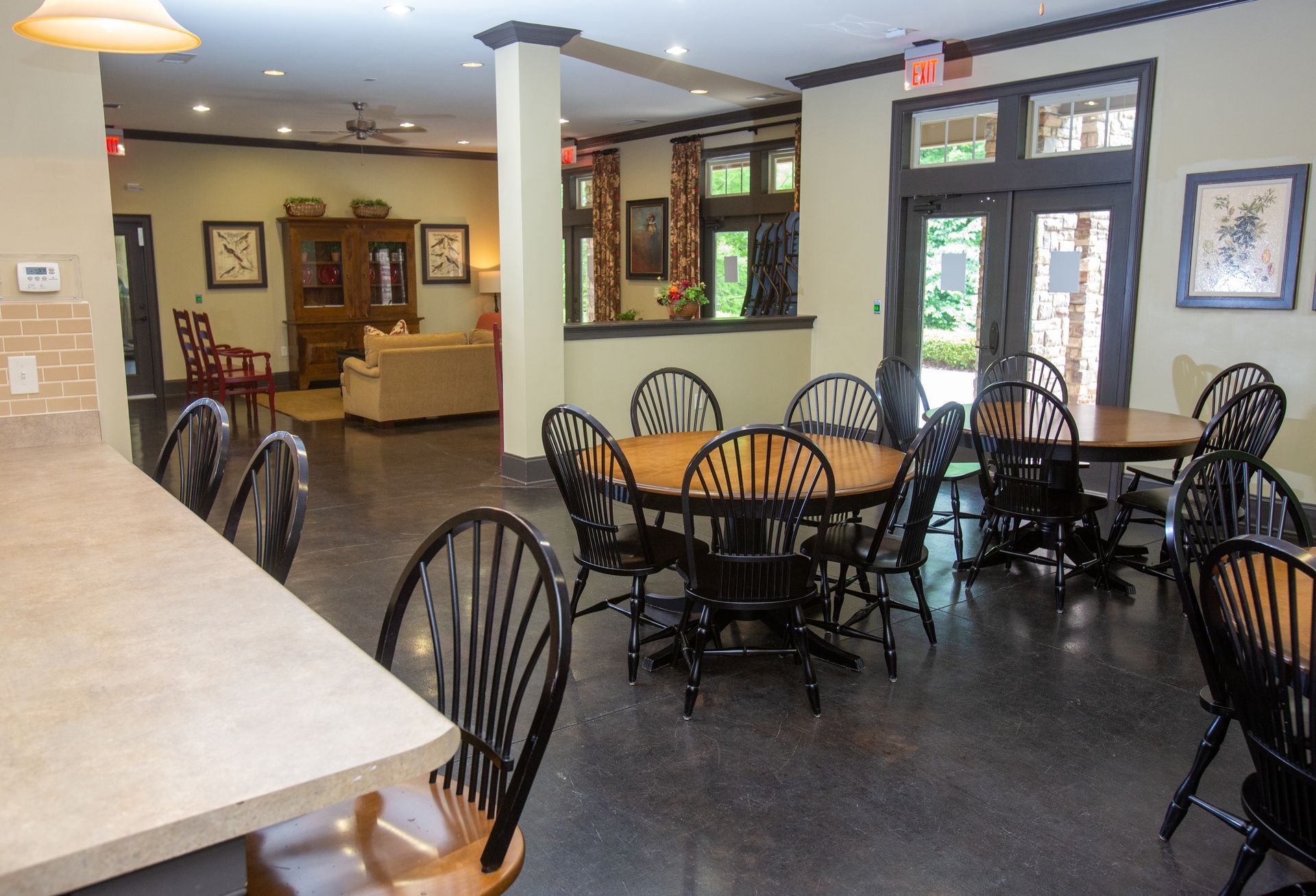A large room with tables and chairs in it