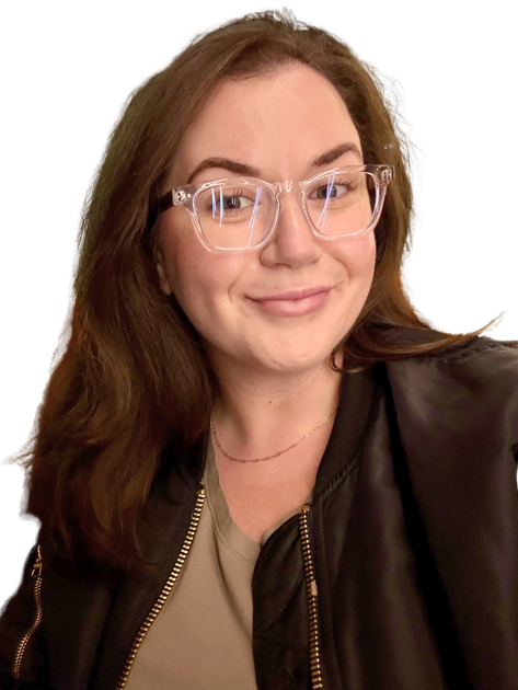 Woman with brown hair and glasses smiling, wearing a black jacket and a gold necklace.