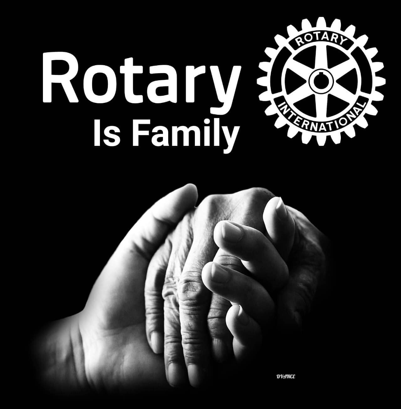 A poster that says rotary is family with two hands holding each other