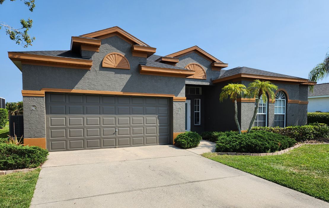 A large house with a garage and a driveway