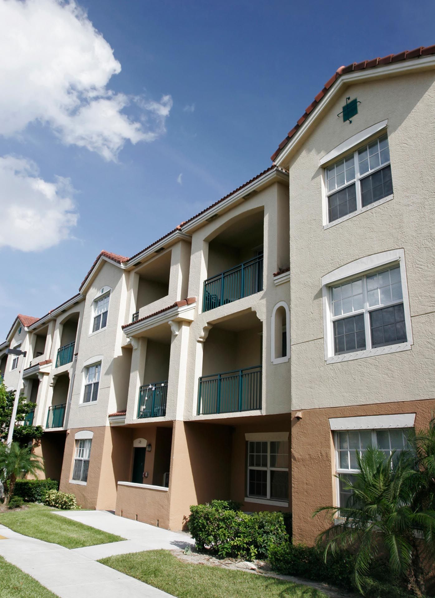 A large apartment building with lots of windows and balconies