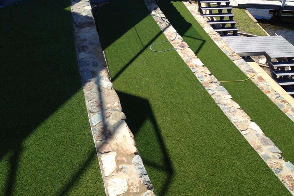 rock retaining walls and artificial grass