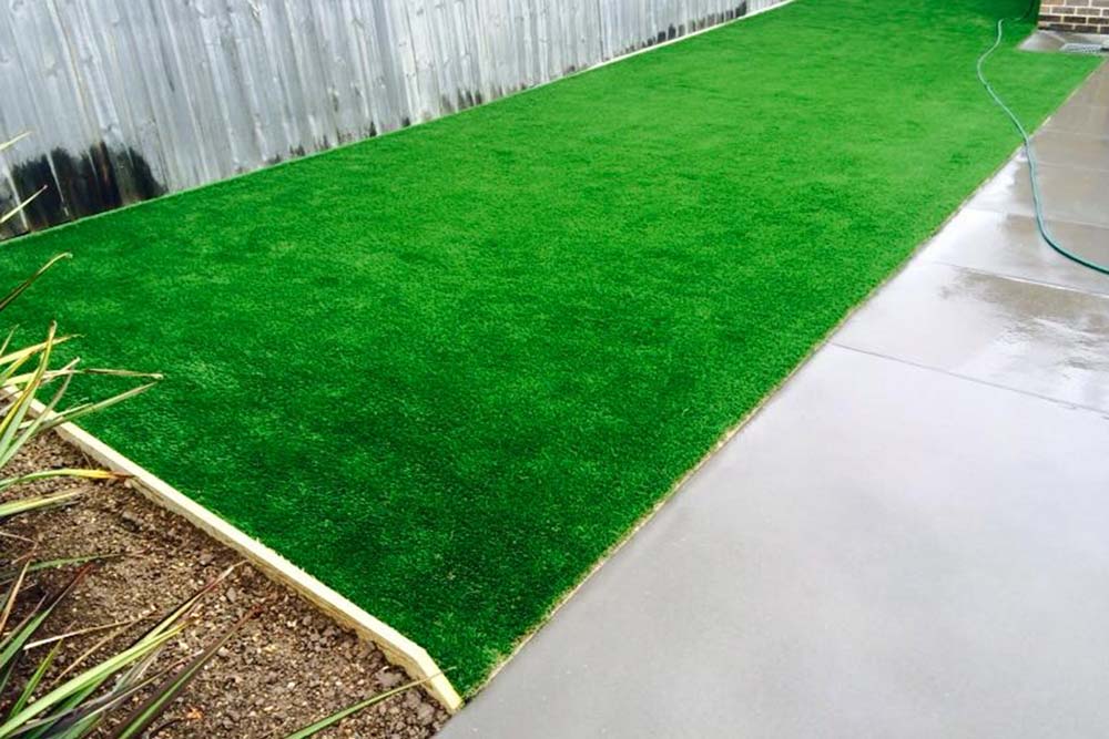 patch of synthetic grass in the backyard