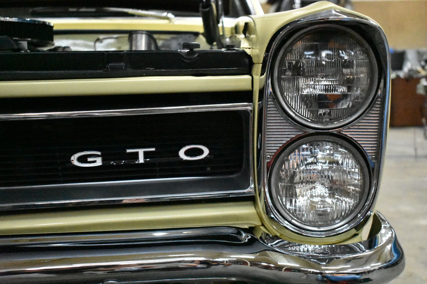 Yellow classic car's front with 