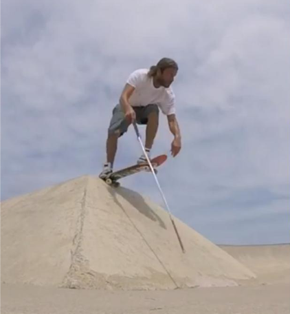 Dan Mancina drops in on a concrete pyramid on his skateboard.