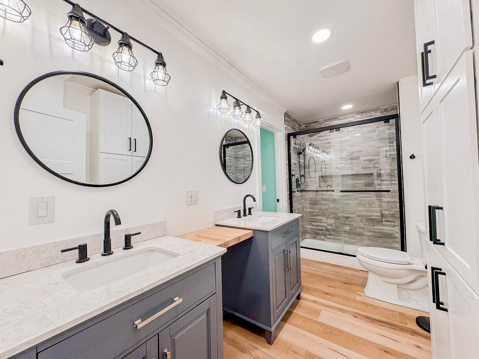 A man is using a sander to sand a ceiling.