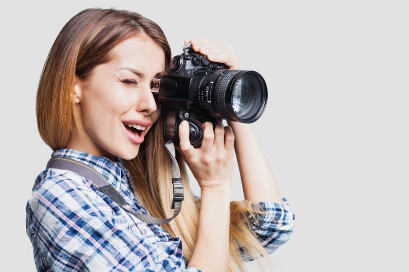 A woman taking a picture with a camera