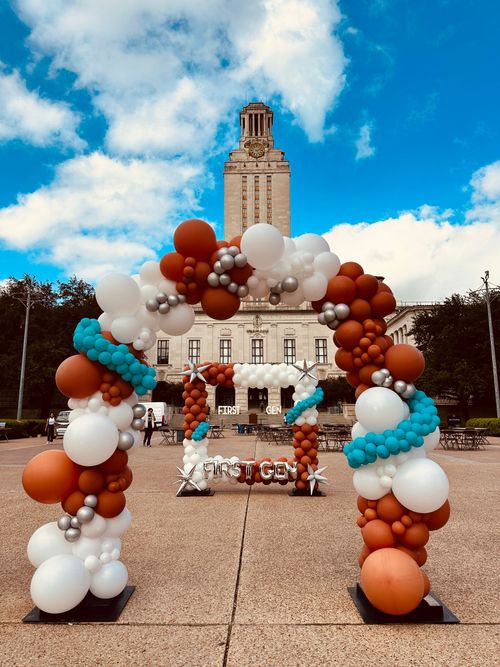 A bunch of balloons with the number 50 on it