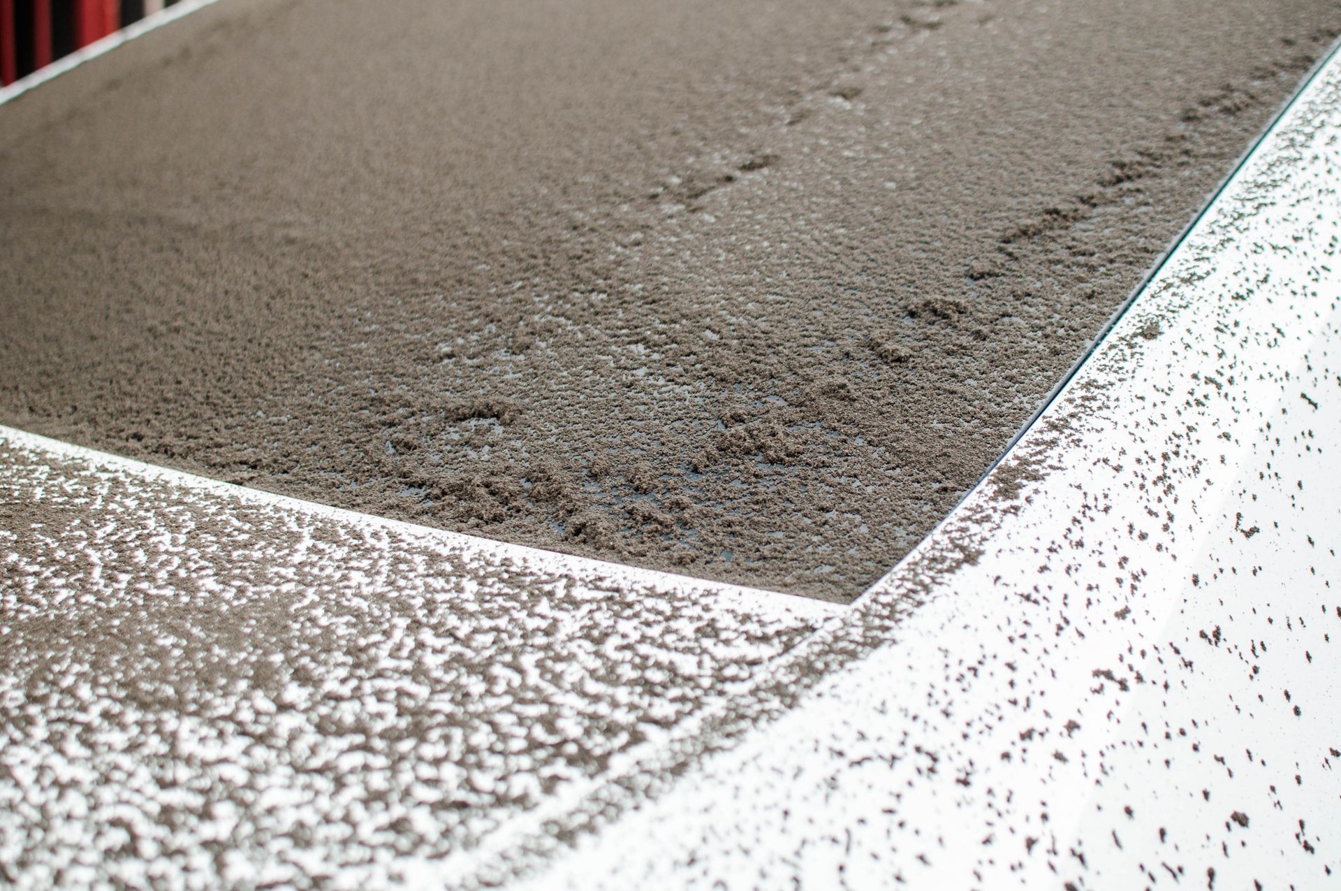 White car windshield covered with dirt