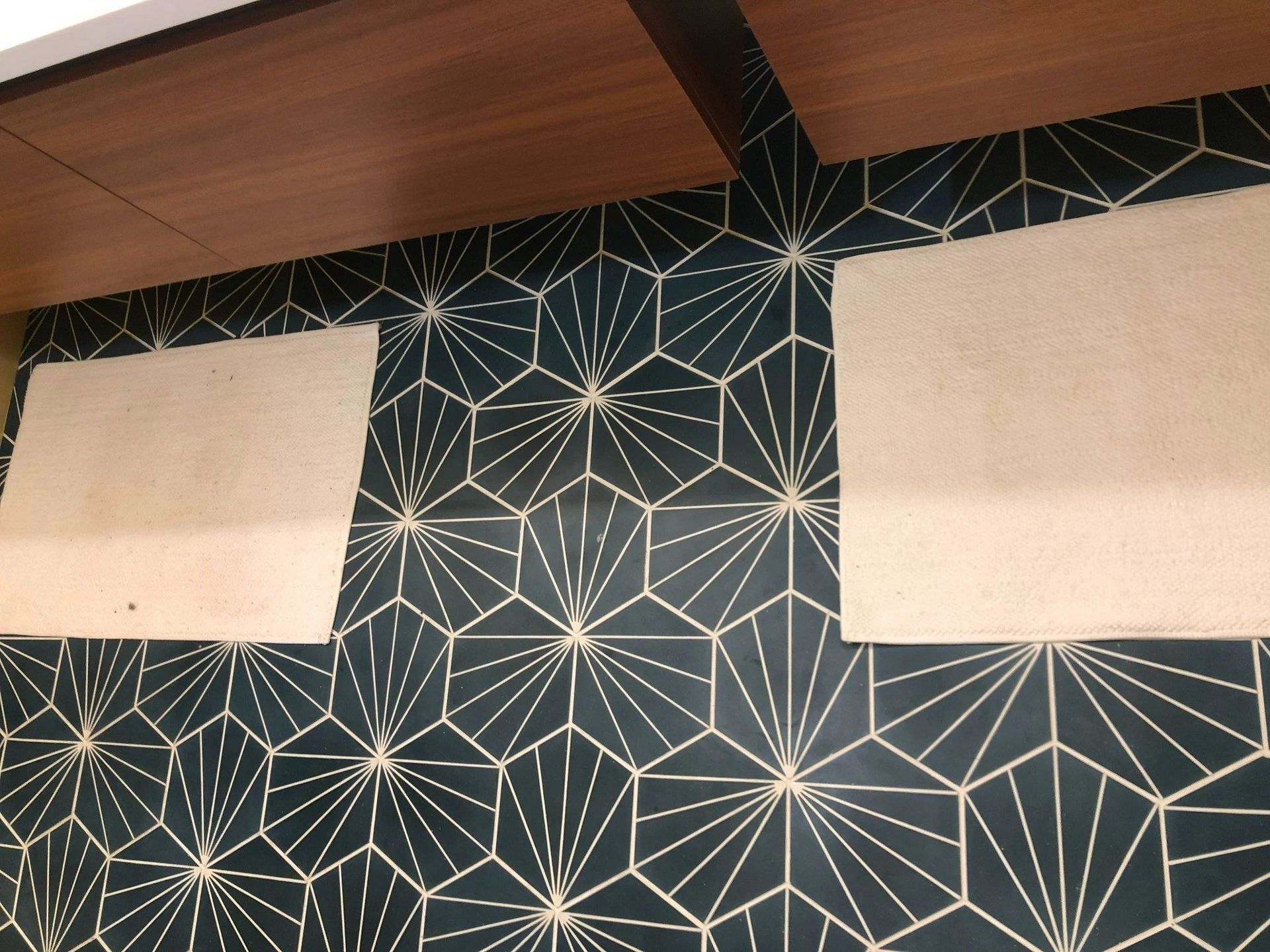 A black and white tile wall with a geometric pattern