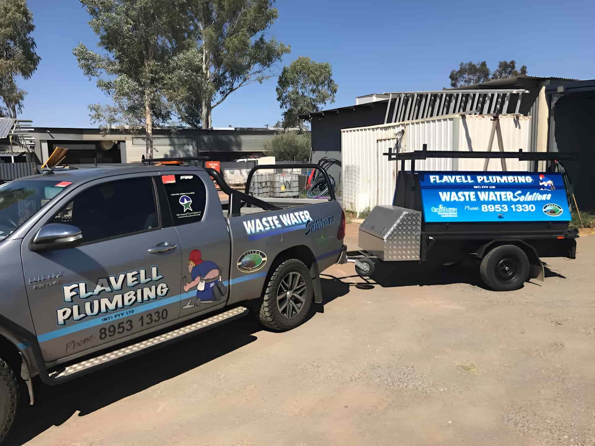 A Truck And Trailer Are Parked Next To Each Other In A Parking Lot — Flavell Plumbing (NT) Pty Ltd In Ciccone, NT