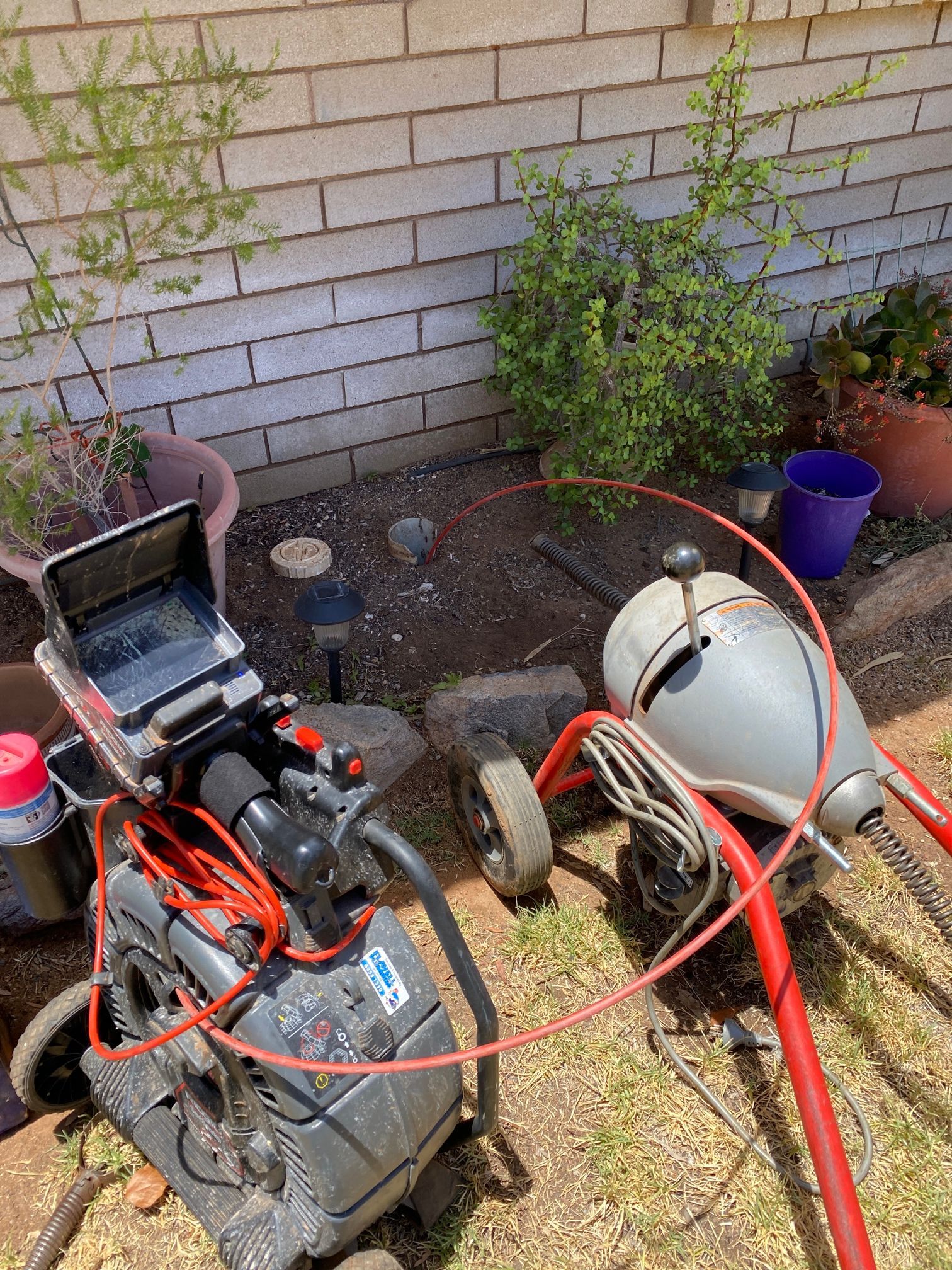 A Person Is Cleaning A Toilet With A Hose — Flavell Plumbing (NT) Pty Ltd In Ciccone, NT