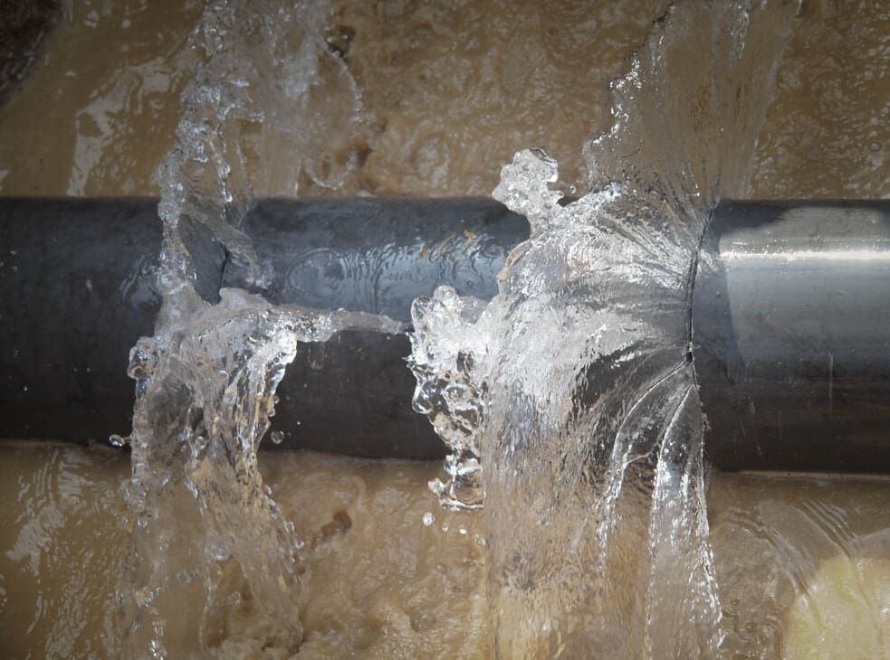 A Pipe Is Leaking Water And Water Is Coming Out Of It — Flavell Plumbing (NT) Pty Ltd In Ciccone, NT