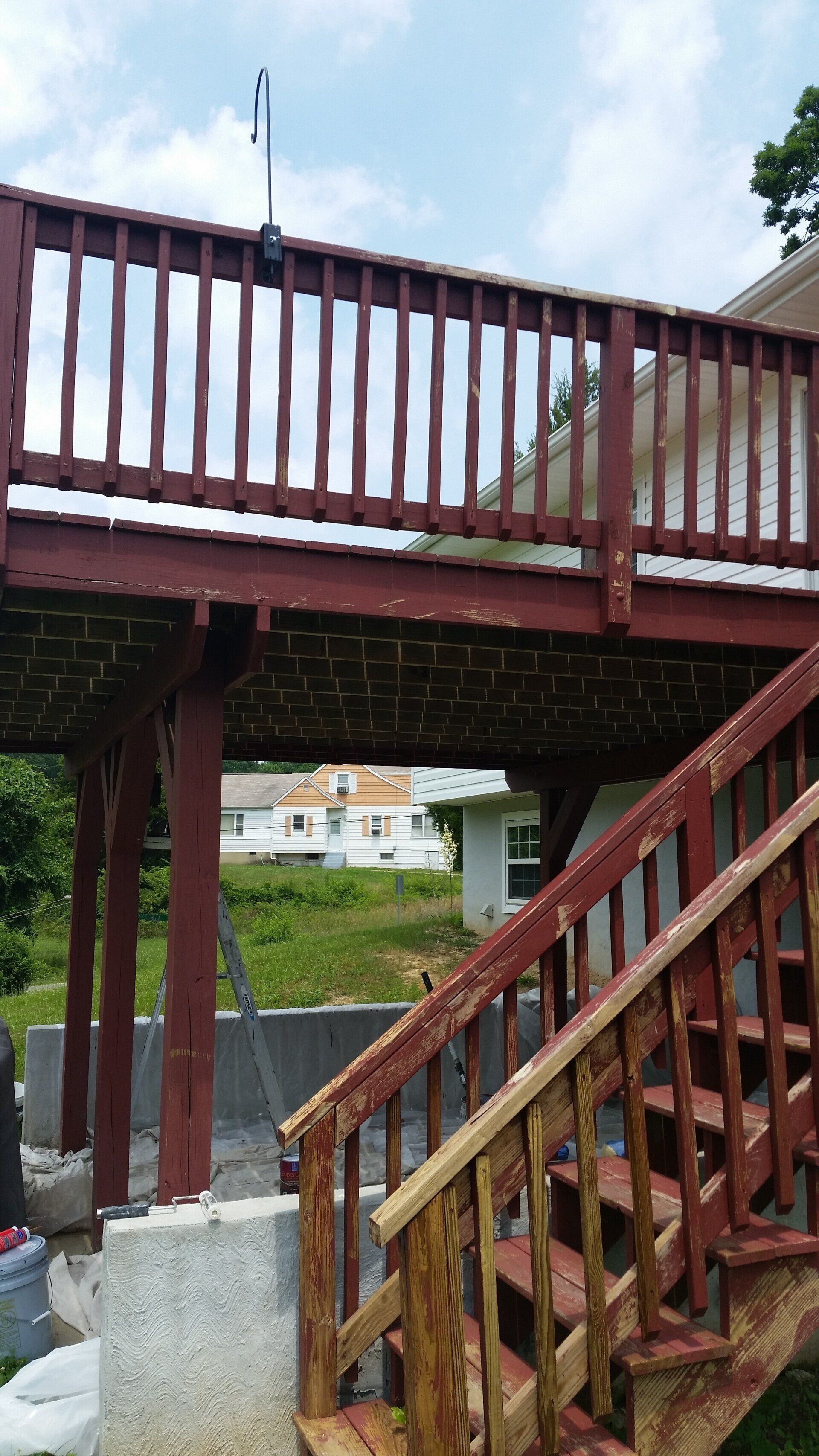 A wooden deck with stairs leading up to it