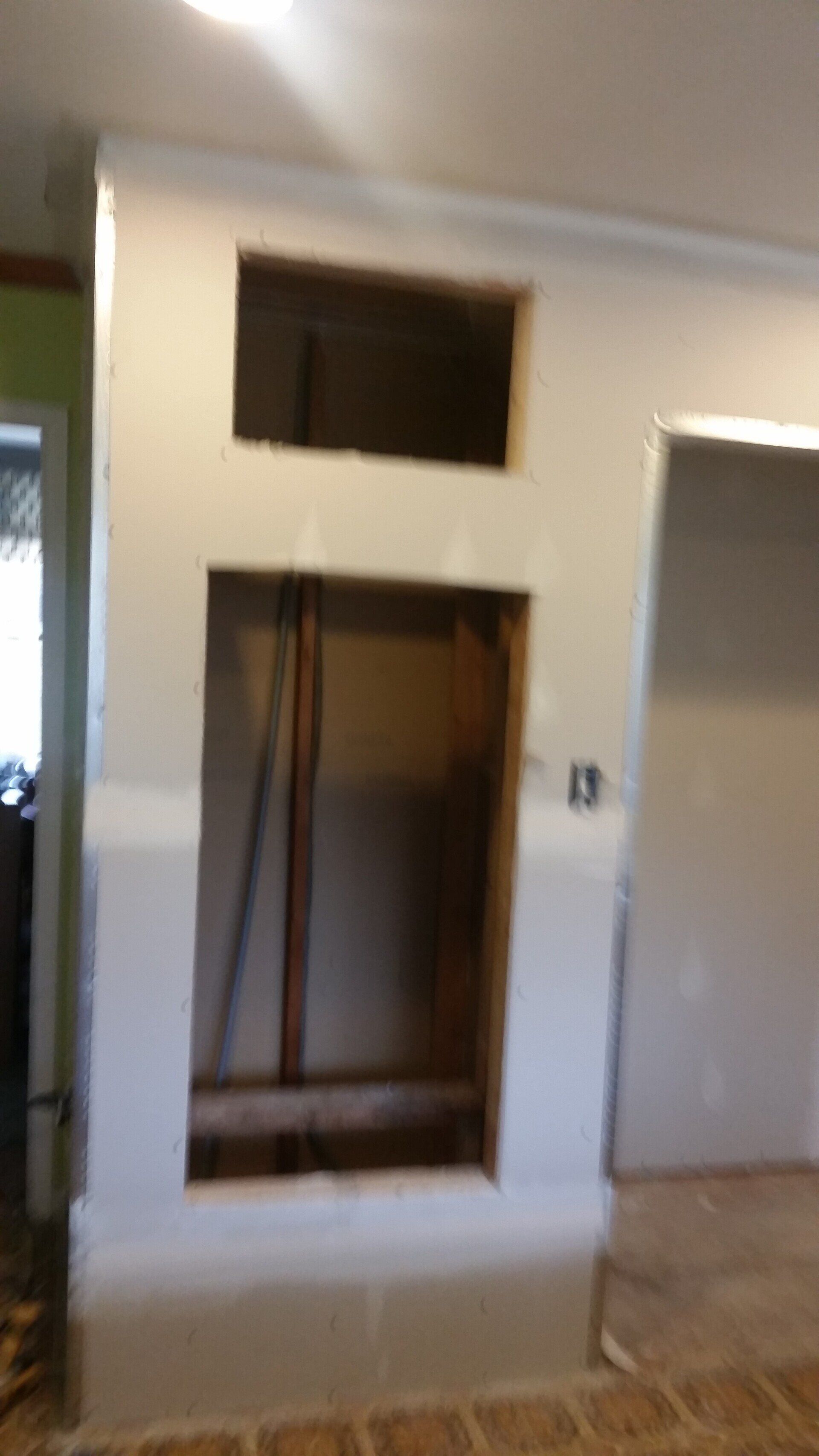 There is a hole in the wall in the middle of the room.