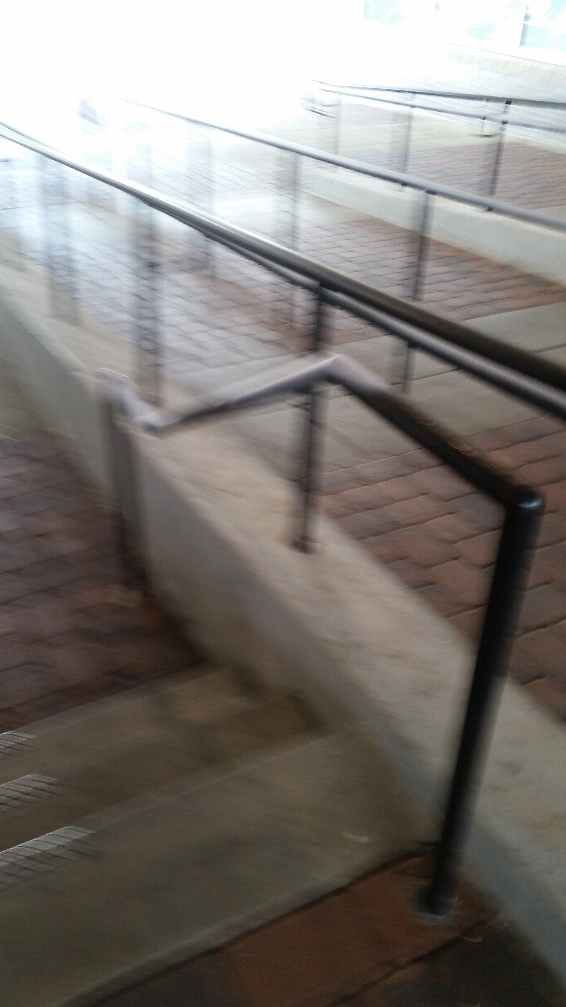 A close up of a railing on a set of stairs.