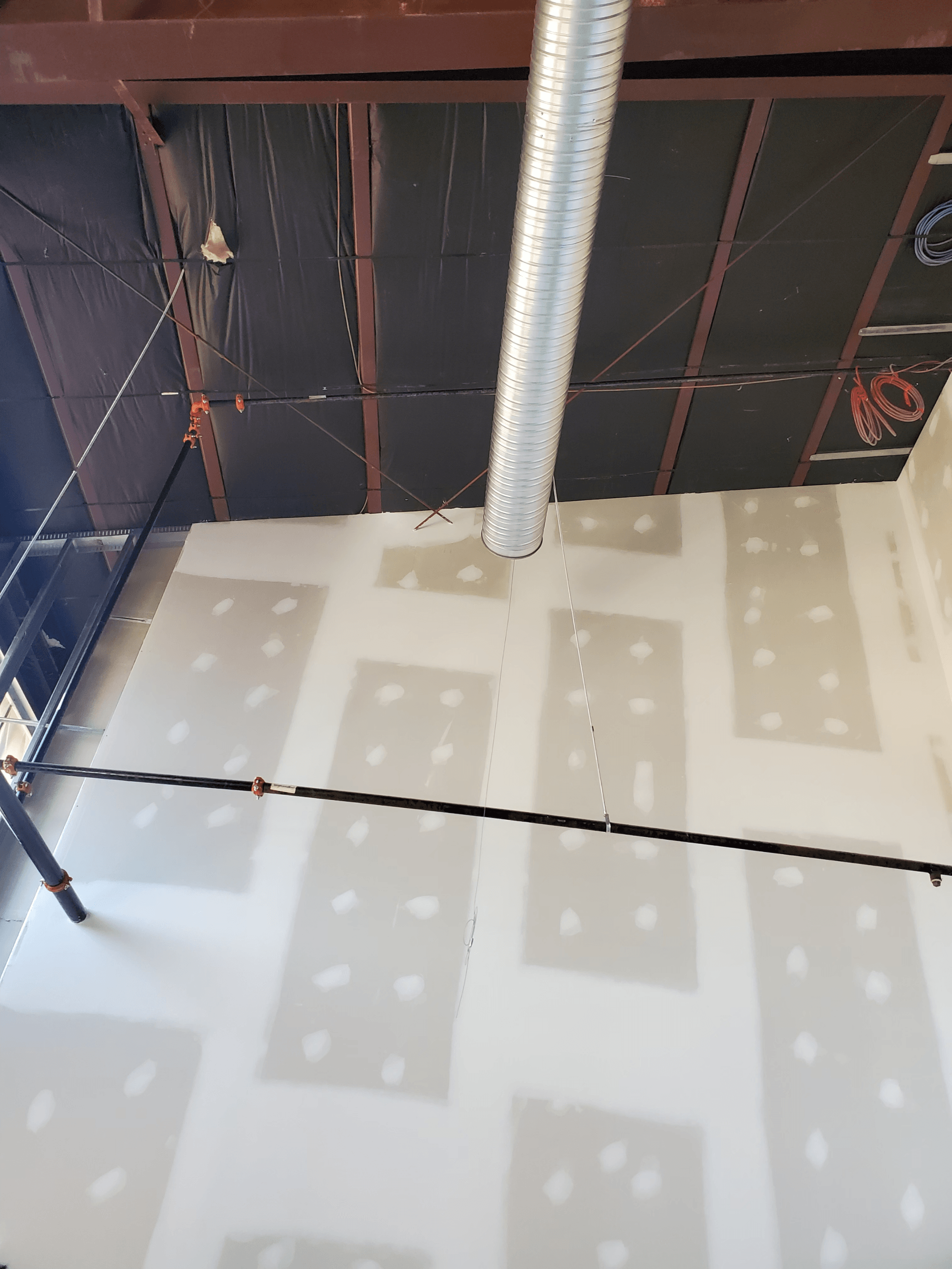 A room with a ceiling that is being remodeled.