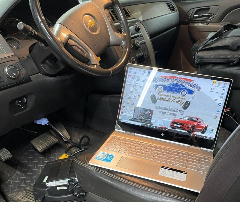 A laptop is sitting in the driver 's seat of a car.