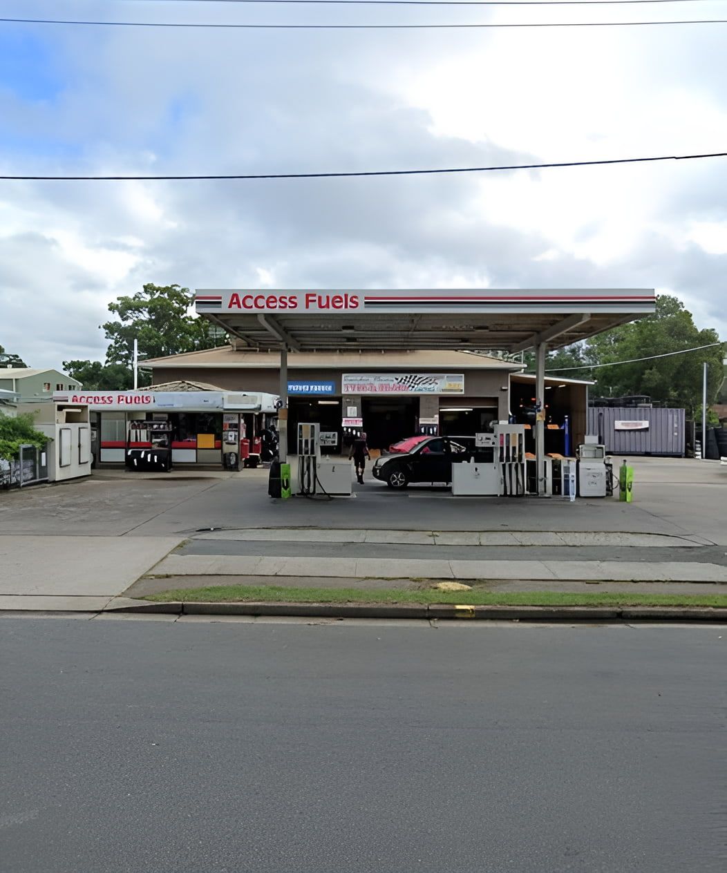 An Access Fuels Gas Station With A Car Parked In Front Of It — Camden Haven Tyre & Brake Centre In Laurieton, NSW