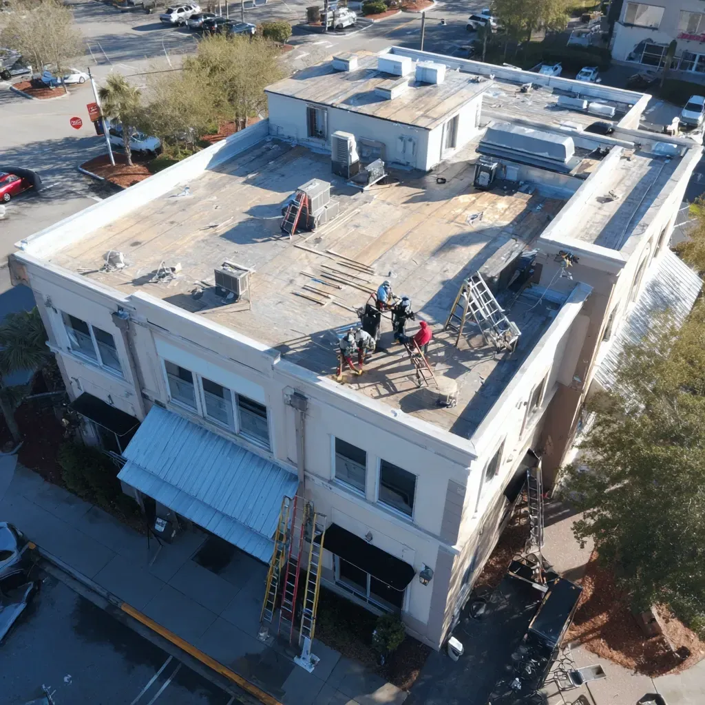 Flat roof waterproofing Brandon FL sealing old EPDM with polyurethane or silicone coating system and reinforced fabric transitions.