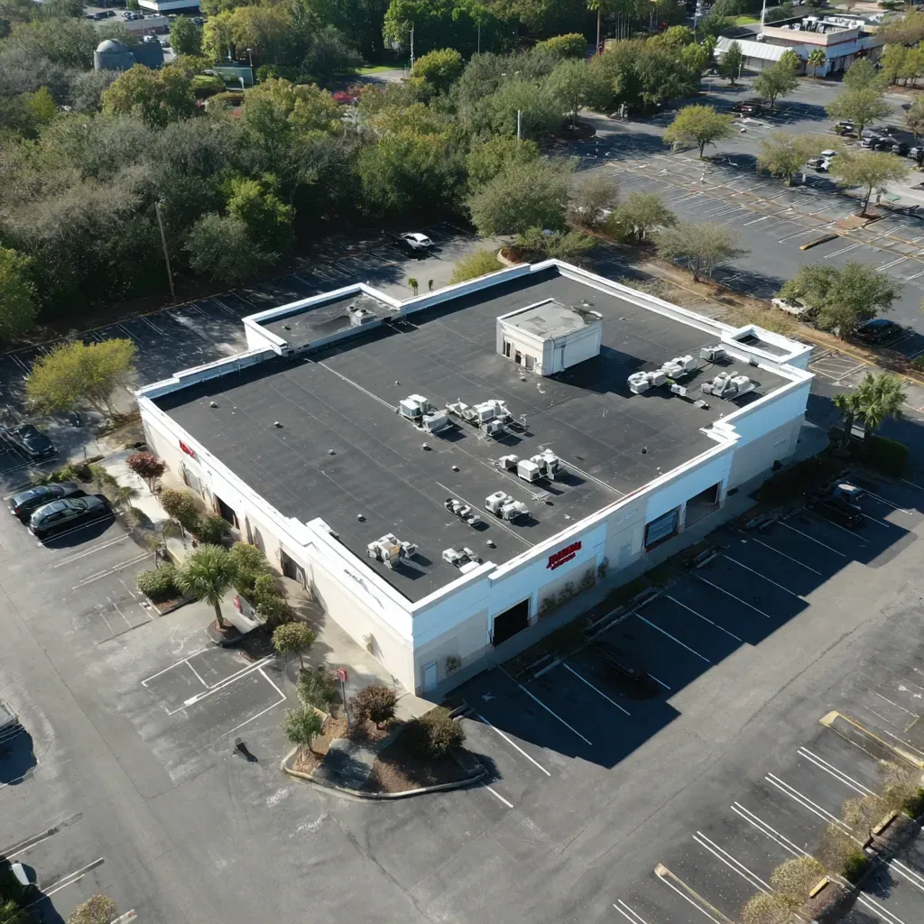 Silicone roof coating Brandon FL teams applying seamless waterproof barriers over commercial low-slope roofs to stop ponding and thermal cracking.